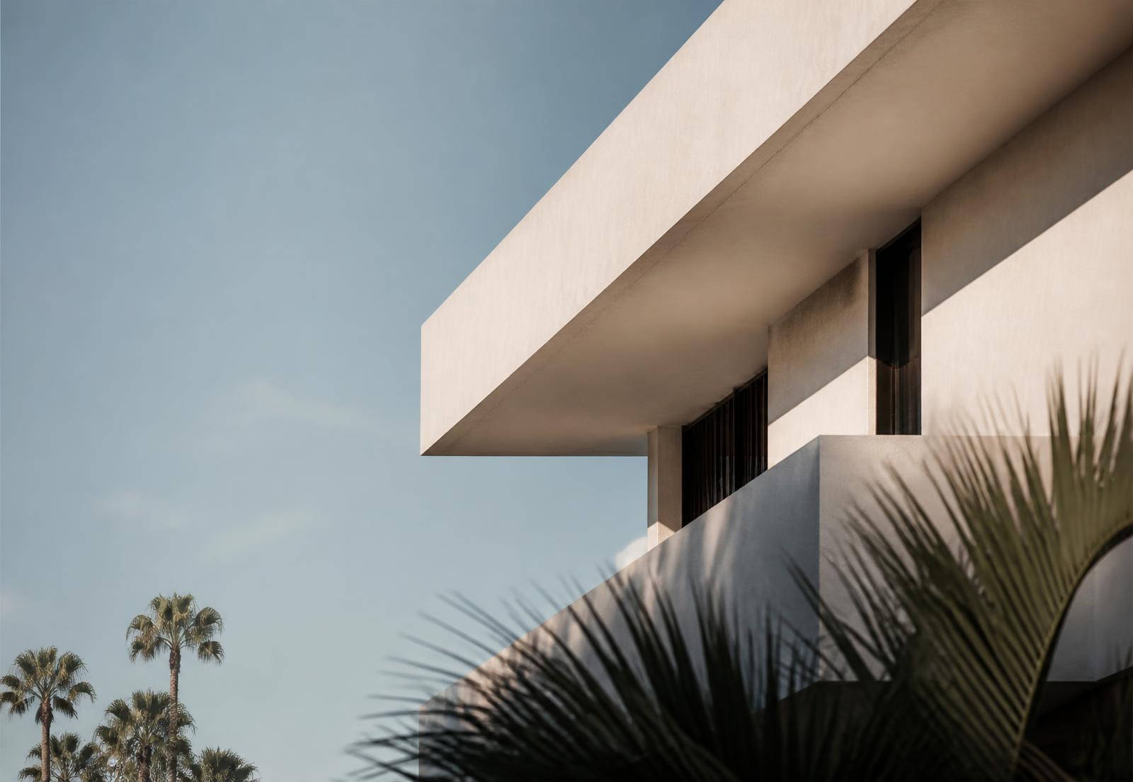 Modernist Santa Monica building against a clear Pacific sky